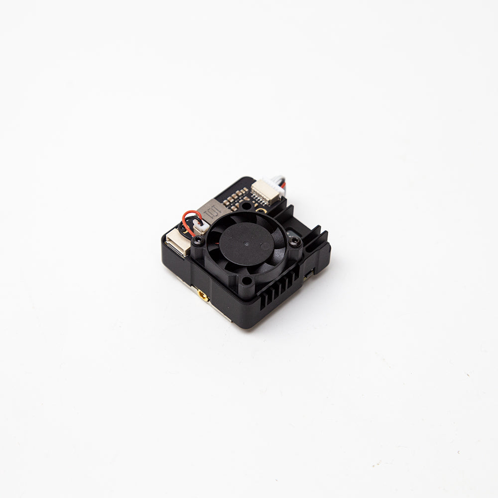 Angled view of VTX module with cooling fan, side connector ports, and heatsink-style housing