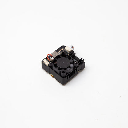 Angled view of VTX module with cooling fan, side connector ports, and heatsink-style housing