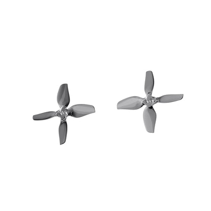 Two gray 4-blade drone propellers, angled view showing hub and blade profile