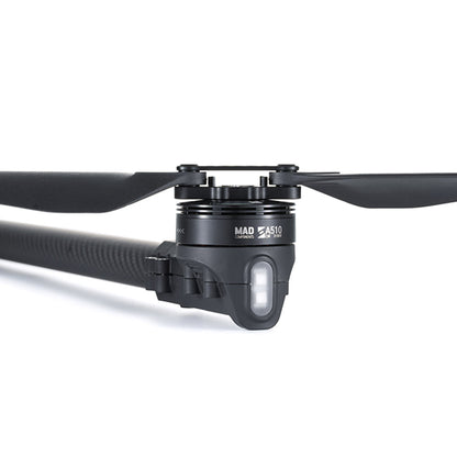 Close-up of MAD StableCore A510 drone arm with carbon-fiber tube, motor mount, and propeller