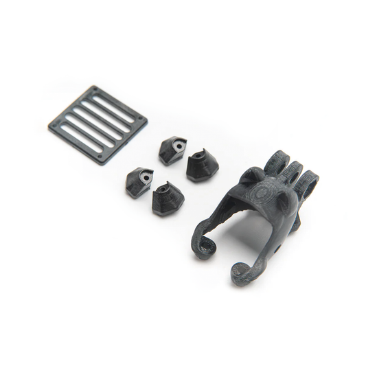 OddityRC XI25 Pro O3 related kit parts with 3D-printed camera mount, spacer blocks, and slotted plate