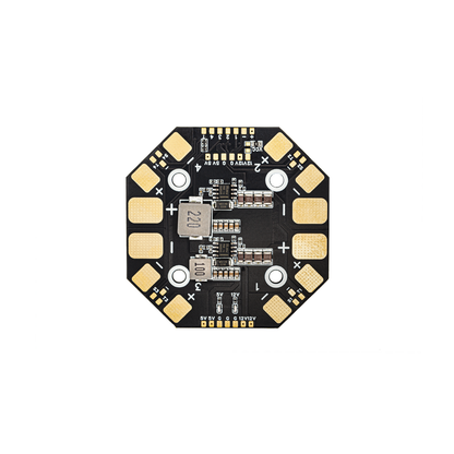 Octagonal power distribution board with solder pads and inductors, top-down close-up