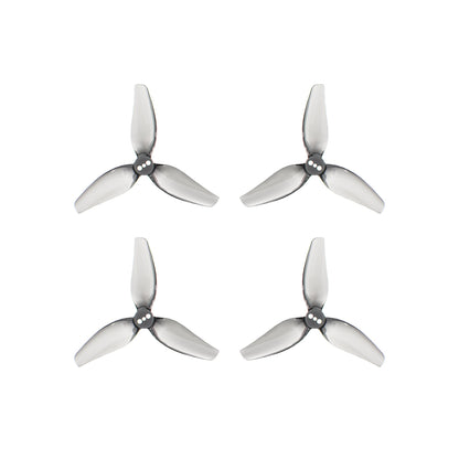 Set of four gray tri-blade drone propellers (2 CW and 2 CCW) arranged in a grid