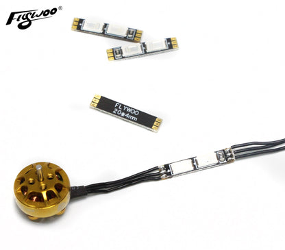 FLYWOO 4PCS 4x20mm Arm LED Board Light, FLYWOO 20x4mm drone arm LED light boards with solder pads and wired strip next to a brushless motor