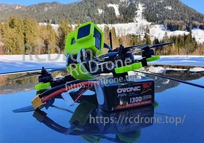 Ovonic 2x 6S 1300mAh 120C LiPo battery pack with XT60 on FPV drone setup outdoors