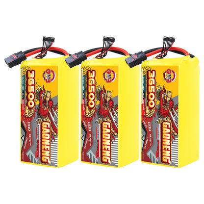 Three yellow GAONENG 36500mAh battery packs lined up, front labels visible