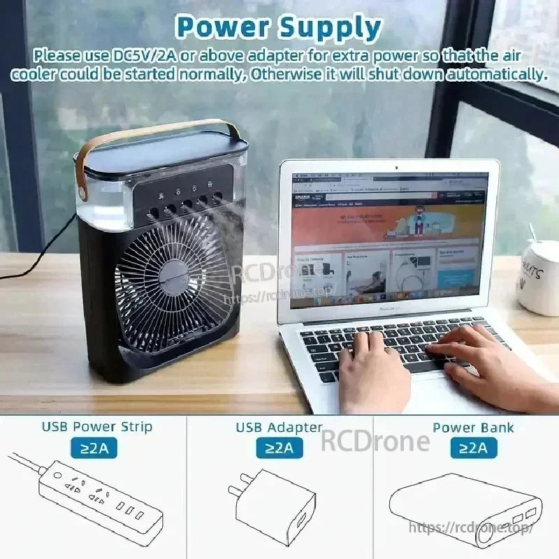 USB-powered mini air cooler beside laptop, recommends DC 5V/2A adapter; examples of power sources