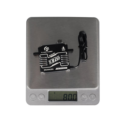 Flashhobby BLS3837MED Servo, Flashhobby BLS3837MED brushless servo on a digital scale, showing 80.0 g with attached lead wire