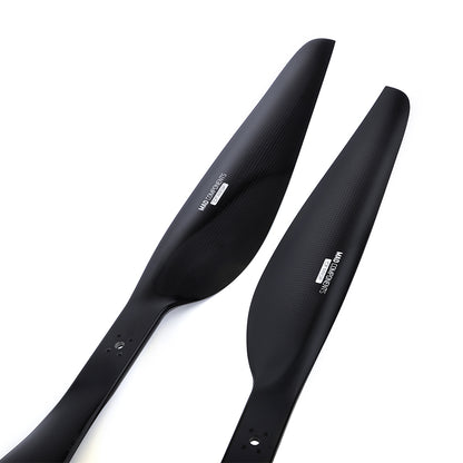 Pair of black carbon fiber drone propeller blades with mounting holes, MAD FLUXER Pro Shine set