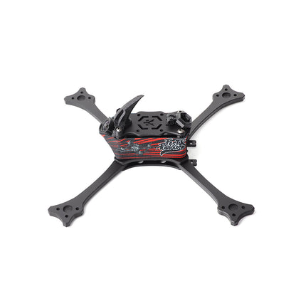 Top-down view of carbon fiber racing drone frame with X layout arms and center top plate