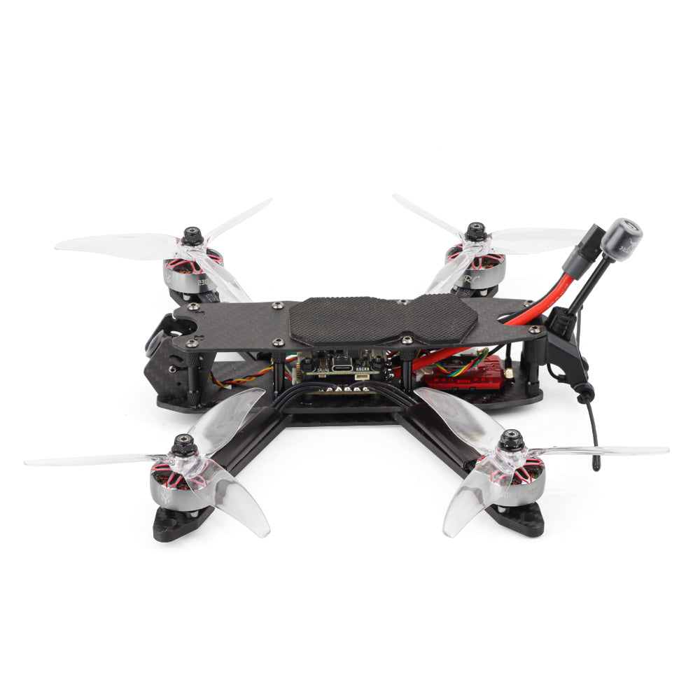 Top-down view of MY5 FPV quadcopter showing carbon top plate, battery pad, wiring, and four motors