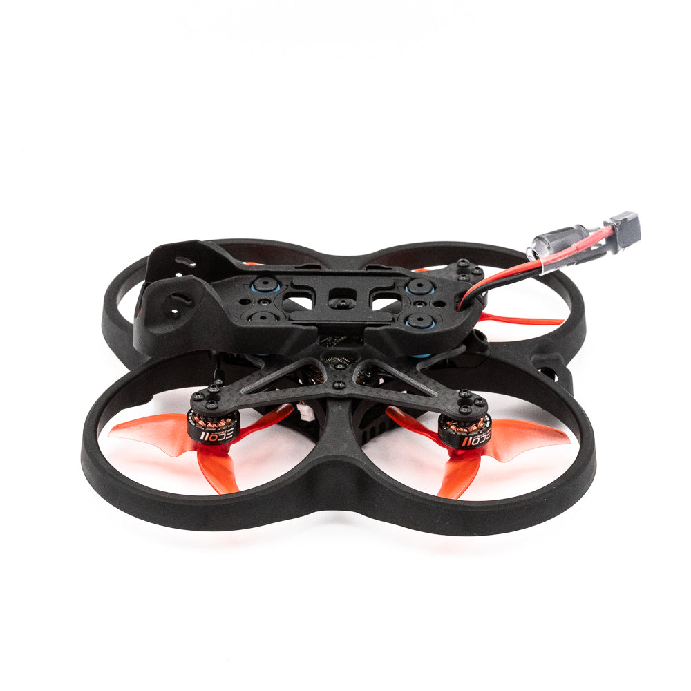 Low side angle of Cinehawk Mini 2.5-inch ducted quad frame with battery lead and orange props
