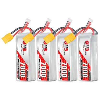 Four GNB 7000mAh battery packs lined up, showing labels and XT90 connectors