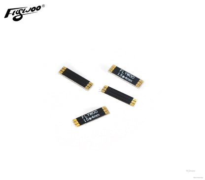Set of four Flywoo frame arm boards with gold solder pads, labeled 15×4mm, for compact drone wiring