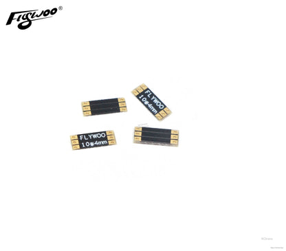 Set of four FLYWOO frame arm boards labeled 10×4mm with gold solder pads on both ends