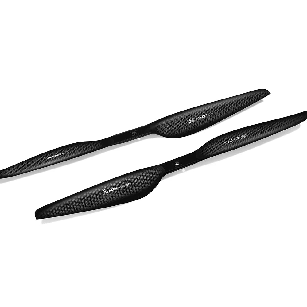 Hobbywing CF 40131 Propeller, Pair of black Hobbywing CF 40131 carbon fiber propellers with textured weave finish and center mounting hole