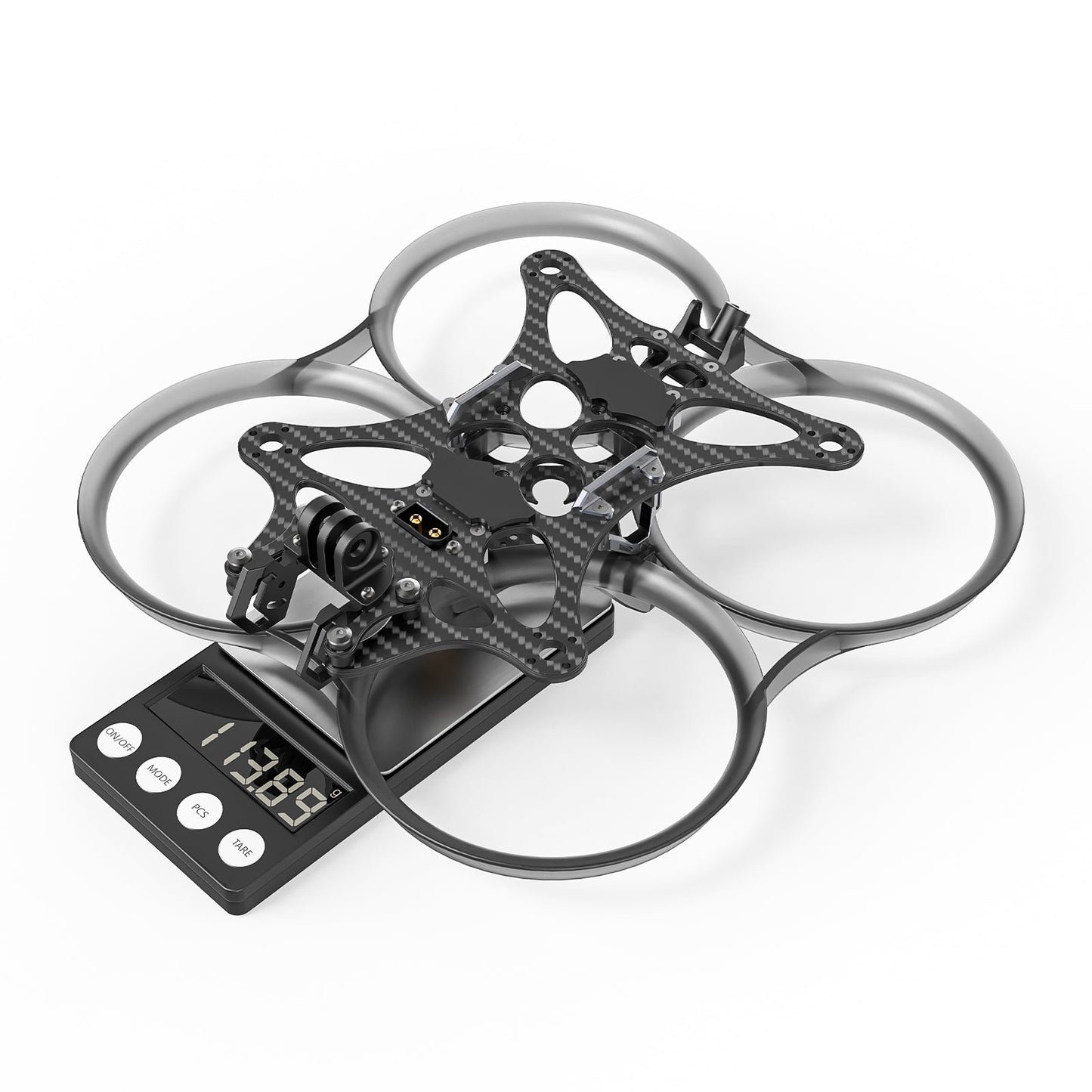 Pavo35 whoop frame kit on digital scale, assembled frame with ducts and carbon top plate