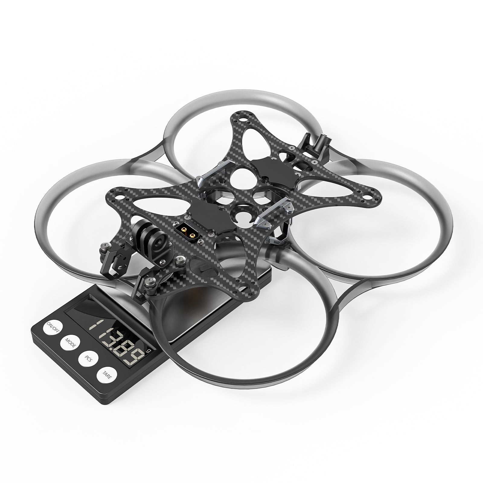 Pavo35 whoop frame kit on digital scale, assembled frame with ducts and carbon top plate