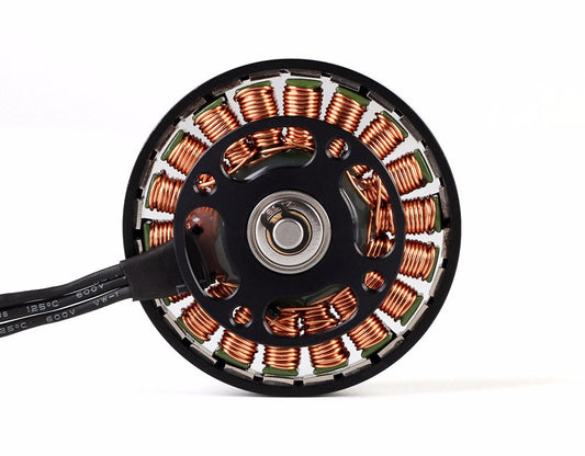 Close-up of a T-Motor brushless outrunner motor showing copper stator windings and power leads