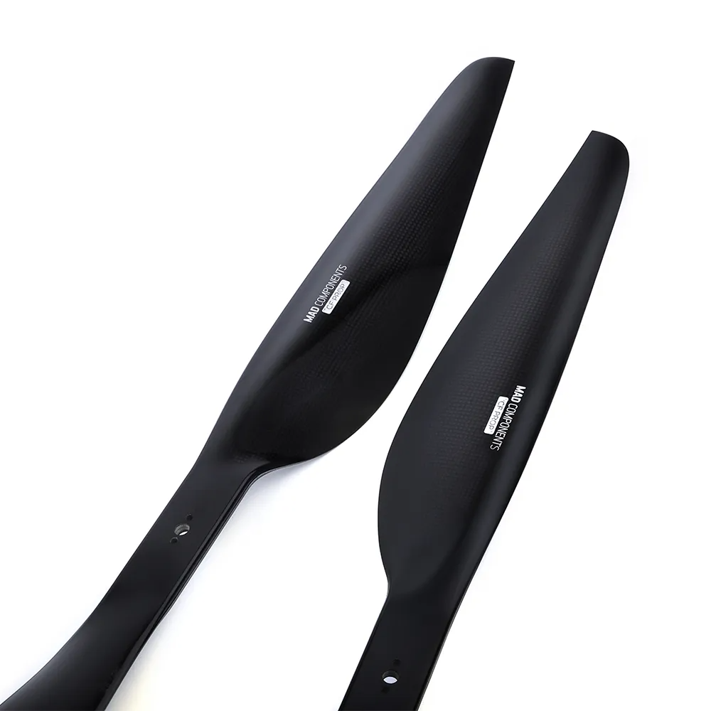 Pair of MAD FLUXER Pro Shine glossy carbon fiber drone propellers in black with mounting holes