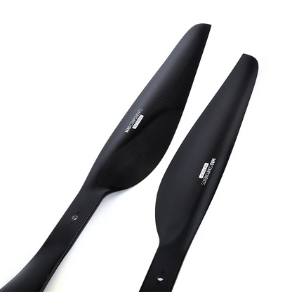 Pair of MAD FLUXER Pro Shine glossy carbon fiber drone propellers in black with mounting holes