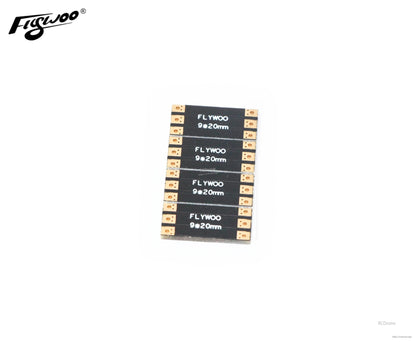 Four Flywoo 9×20mm FPV drone frame arm boards with copper solder pads on both ends
