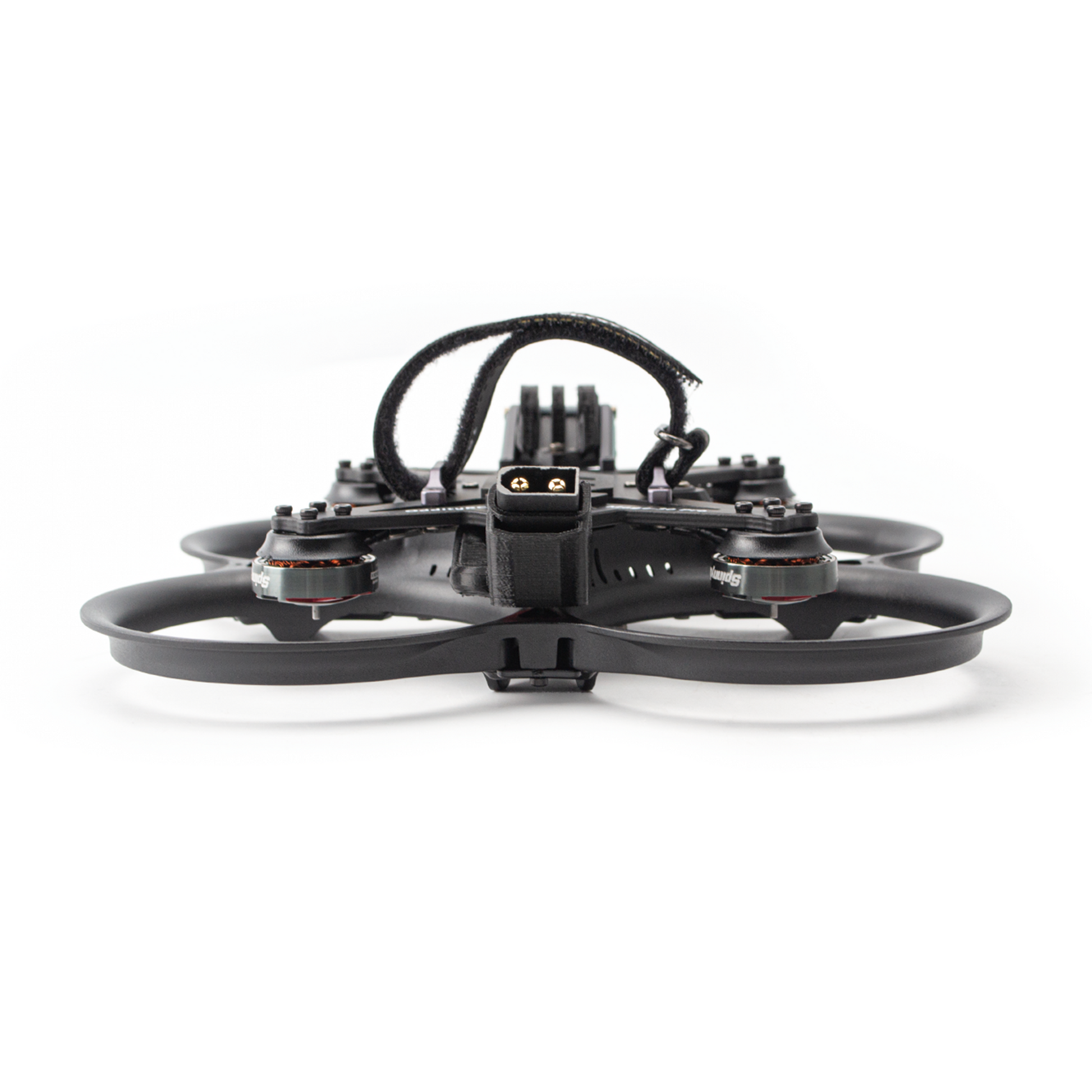 Rear view of ducted FPV drone showing battery lead exit and motor layout in guards