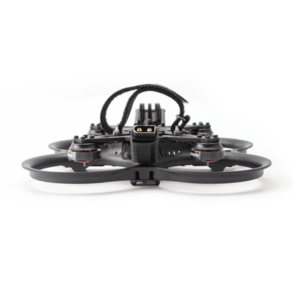 Rear view of ducted FPV drone showing battery lead exit and motor layout in guards