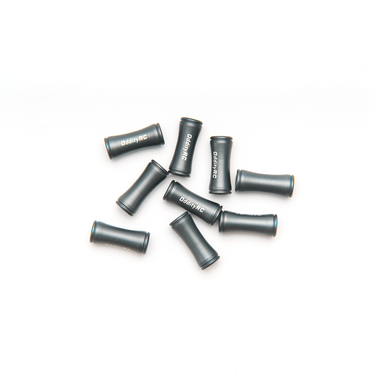 Top view of multiple OddityRC branded aluminum standoffs, black anodized finish
