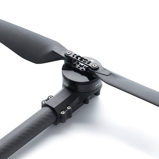 MAD StableCore A510 Drone Arm, Carbon fiber drone arm with mounted motor and two-blade propeller, close-up of the hub and screws