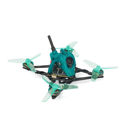 Angled rear-quarter view showing carbon frame arms, teal canopy, antenna, and four 2-inch props