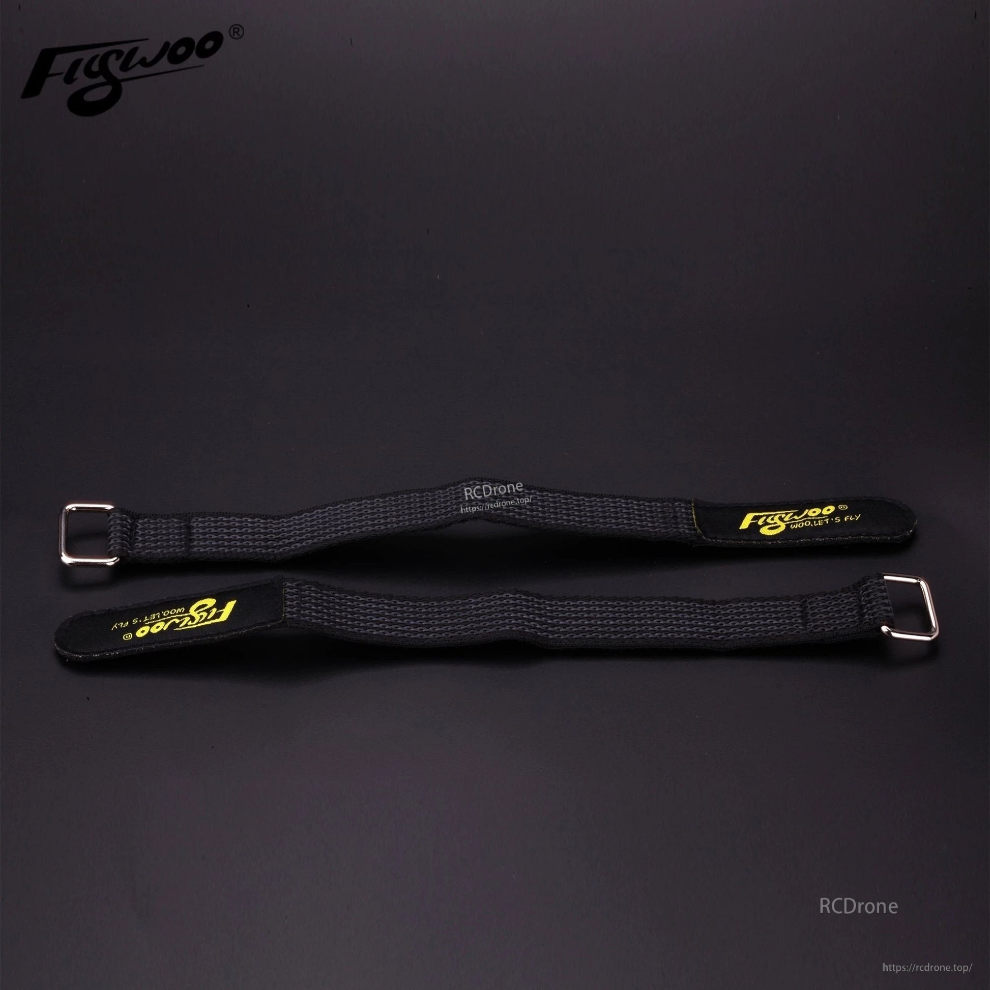 4pcs FLYWOO Kevlar Battery Strap, Two black Flywoo Kevlar battery straps with metal buckles and yellow Flywoo branding on a dark surface
