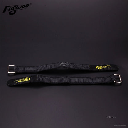 4pcs FLYWOO Kevlar Battery Strap, Two black Flywoo Kevlar battery straps with metal buckles and yellow Flywoo branding on a dark surface