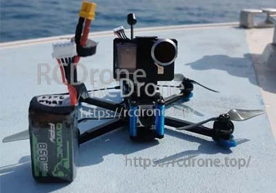 Ovonic 4S 850mAh 14.8V LiPo battery with XT30 plug beside a small FPV drone for scale
