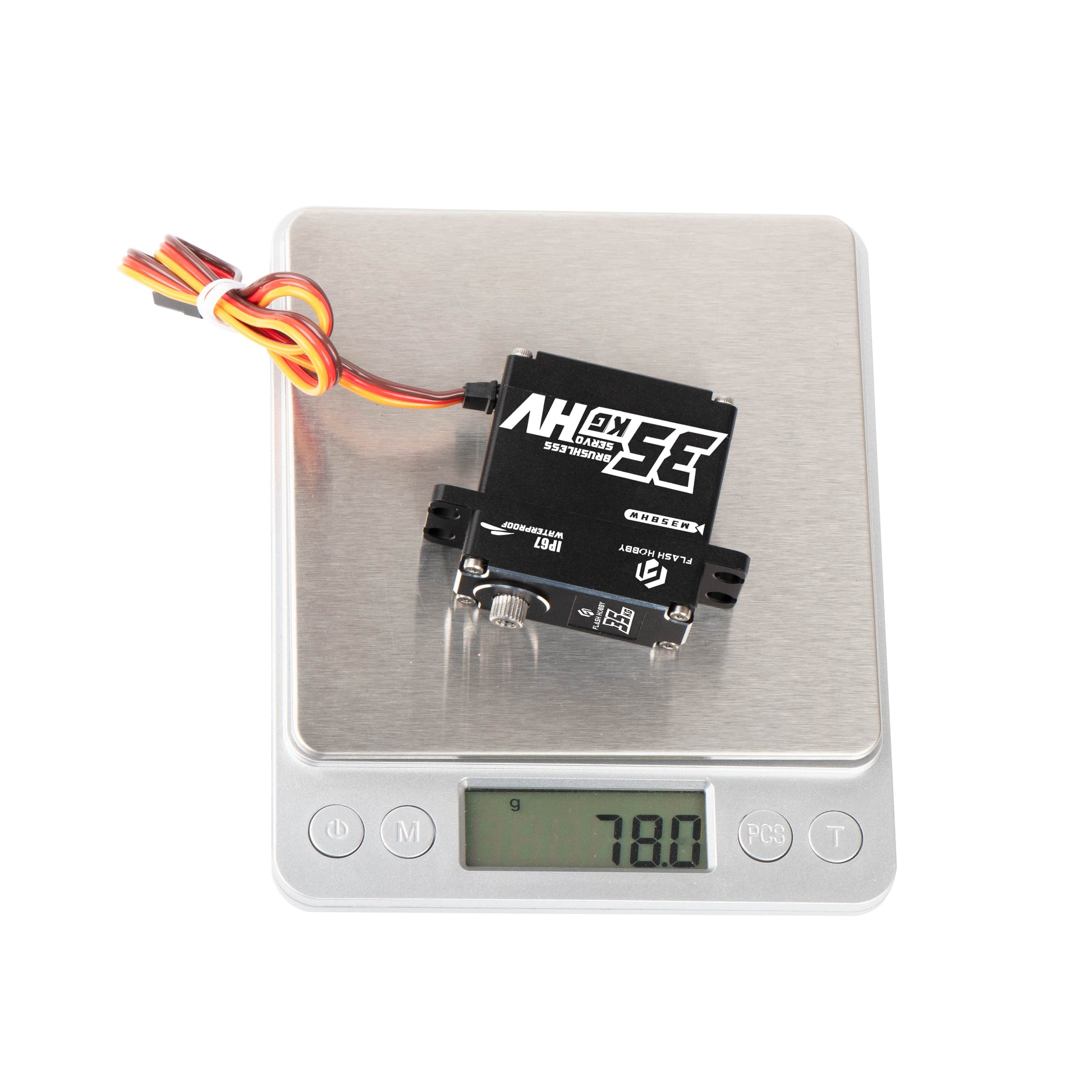 Flashhobby M35BHW brushless digital servo with 3-wire lead on a digital scale reading 78.0 g