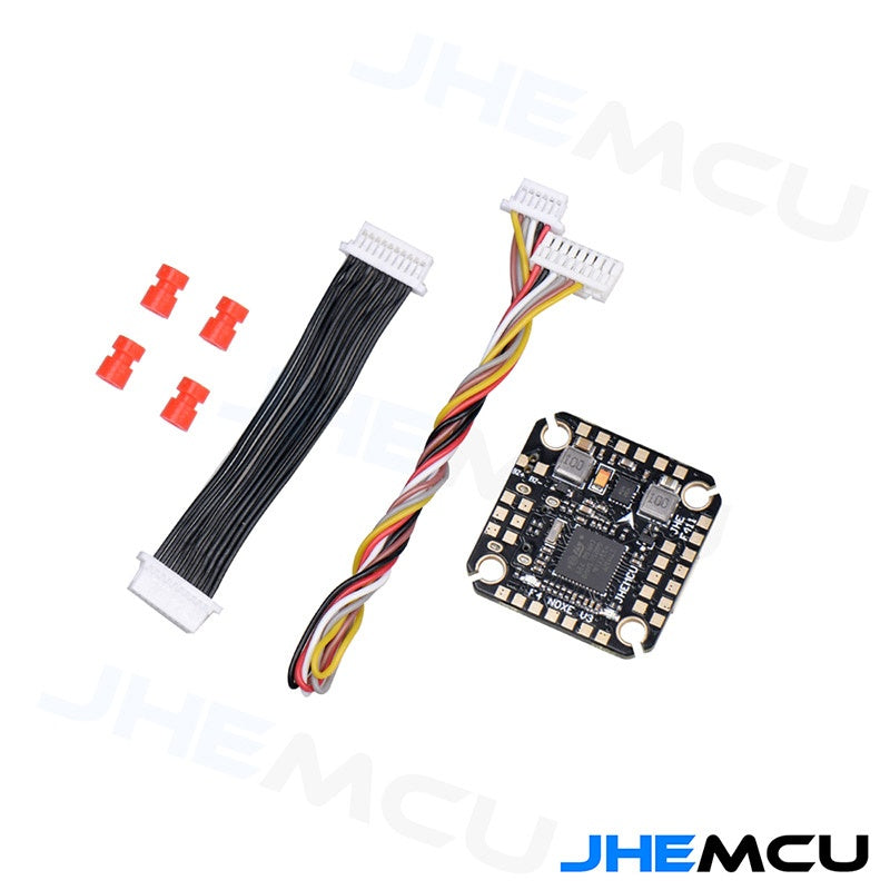 Package contents: flight controller board with two wiring harnesses and red silicone grommets