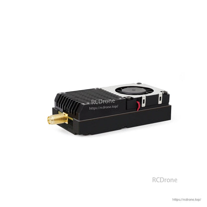 Angled view of FPV video transmitter showing finned heatsink, top cooling fan, and SMA connector