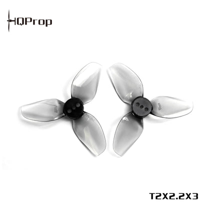 HQProp T2X2.2X3 tri-blade propellers with printed model text on image, grey transparent blades