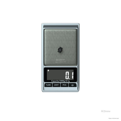 Small black rubber damping ball for Flywoo O3/O4 air unit mounts on a digital scale showing 0.1 g