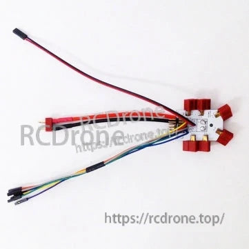 Power distribution board wiring layout with multicolor leads and red battery plug, watermark background