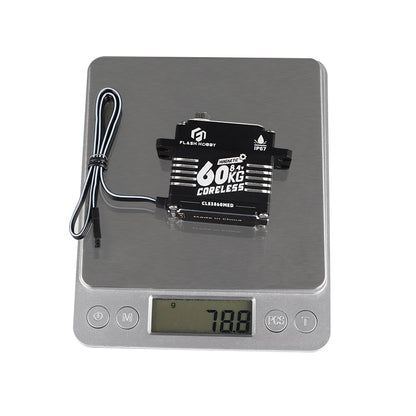 Flashhobby CLS3860MED coreless digital servo labeled 60KG 8.4V and IP67, on a scale reading 78.8 g