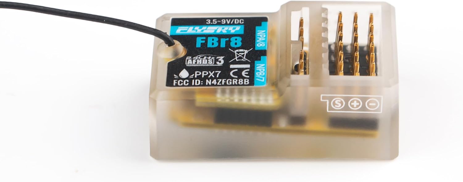 Flysky FBr8 receiver side angle showing 3.5–9V input marking, signal pins, and antenna lead