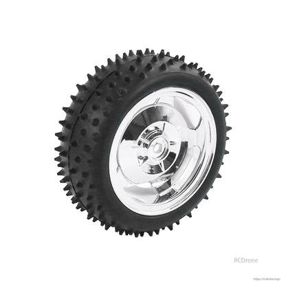 High-friction rubber wheel with spiked tread and silver hub, single wheel close-up