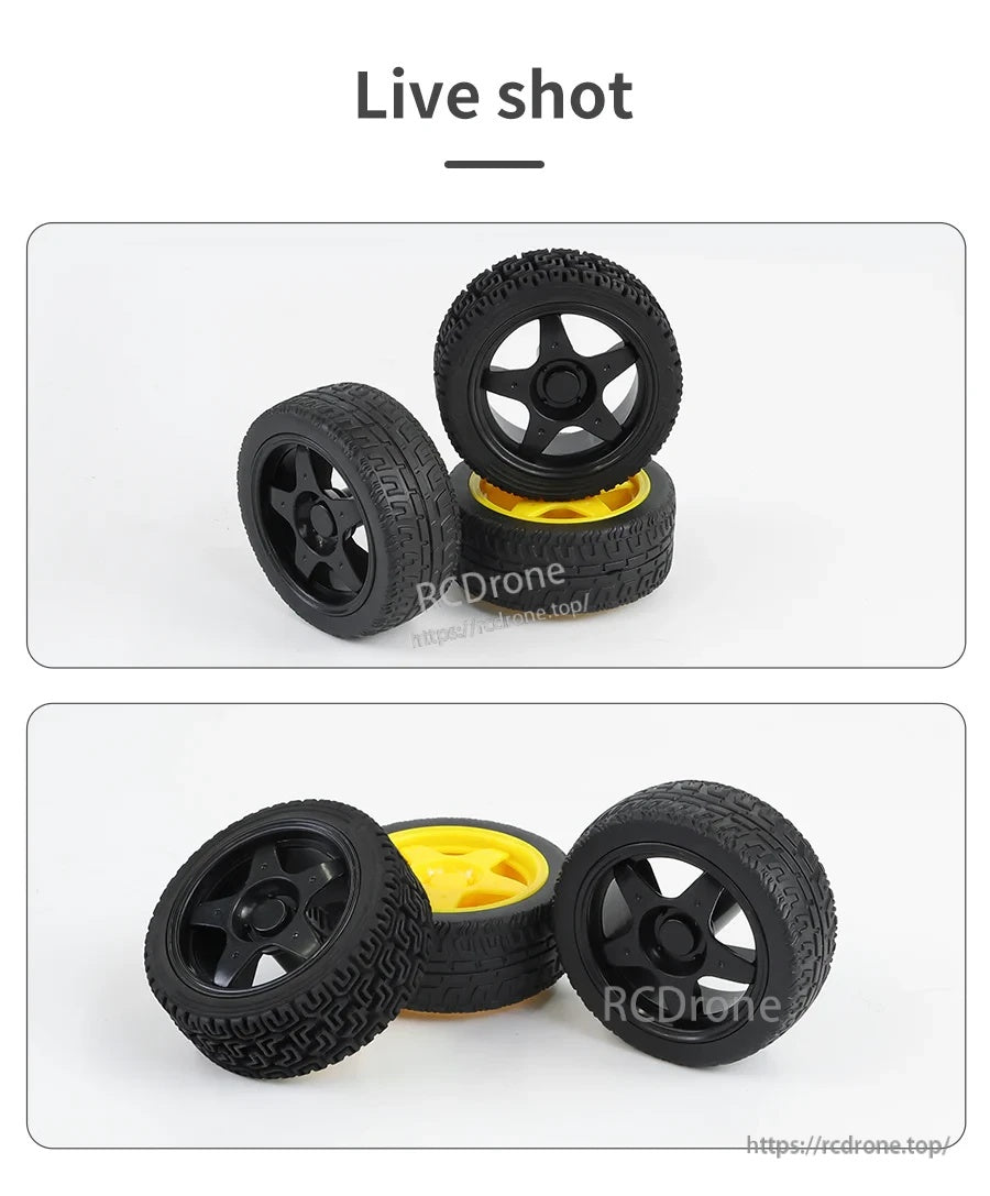Live product photo of 65mm TT motor rubber wheels stacked, showing black ABS hubs and rubber tread