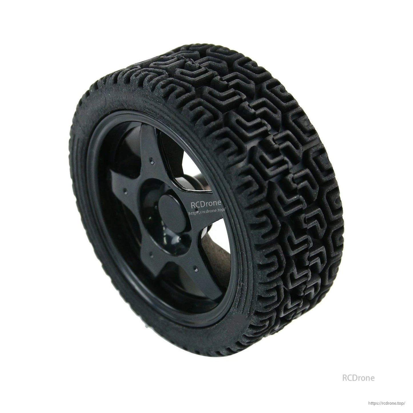 High-friction 65mm rubber wheel close-up with deep maze tread and black ABS hub