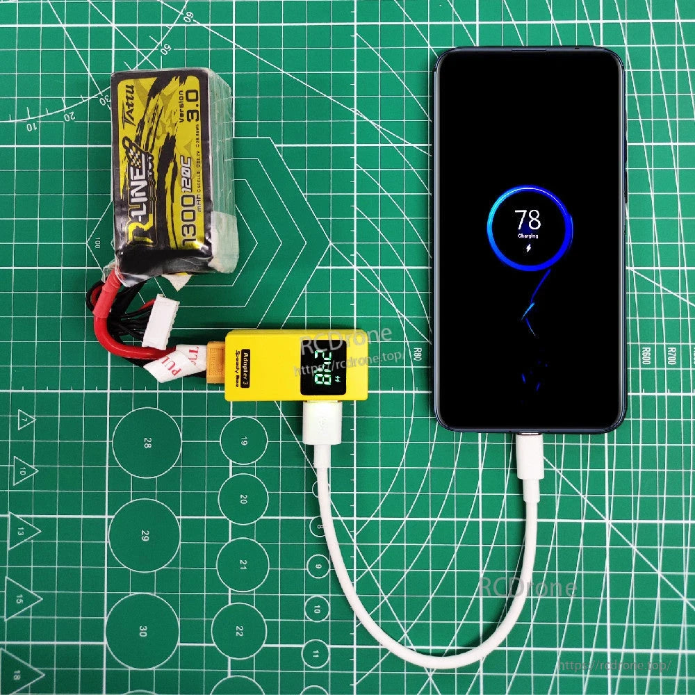 6A USB-A to USB-C Super Fast Charging Cable, Short white USB charging cable connected to a smartphone through a USB power meter on a cutting mat