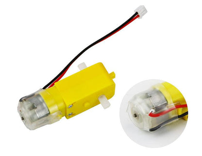 Side view of yellow TT motor with lead wires; inset close-up of clear end cap and soldered wire inside