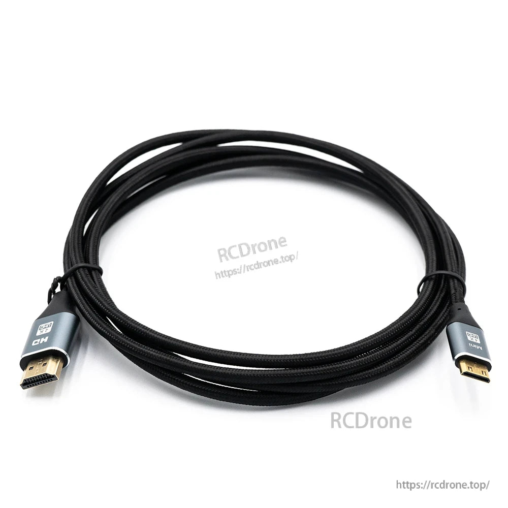 Coiled braided HDMI to mini HDMI cable on white background, connector ends visible with RCDRone watermark