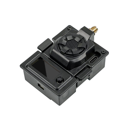 Black micro TX module angled view showing OLED screen window, control button and top housing