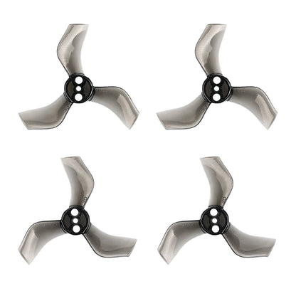 Smoke gray 3-blade whoop propellers with black hub, four props displayed on white background